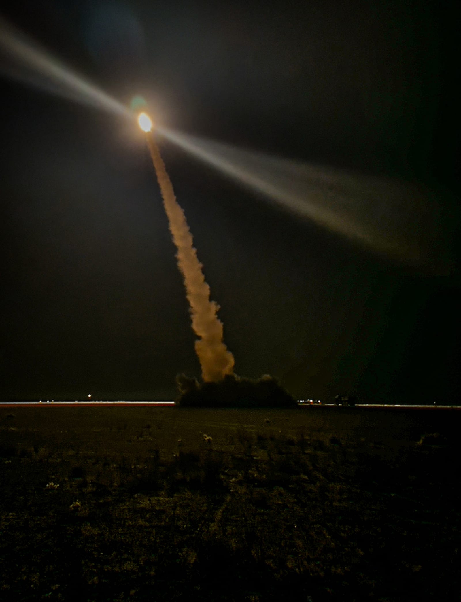 A U.S. Army soldier fires a GMLRS rocket from an M142 HIMARS launcher during a live-fire exercise in Northeast Syria