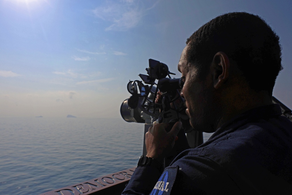 The guided-missile destroyer USS Roosevelt navigating the Strait of Hormuz