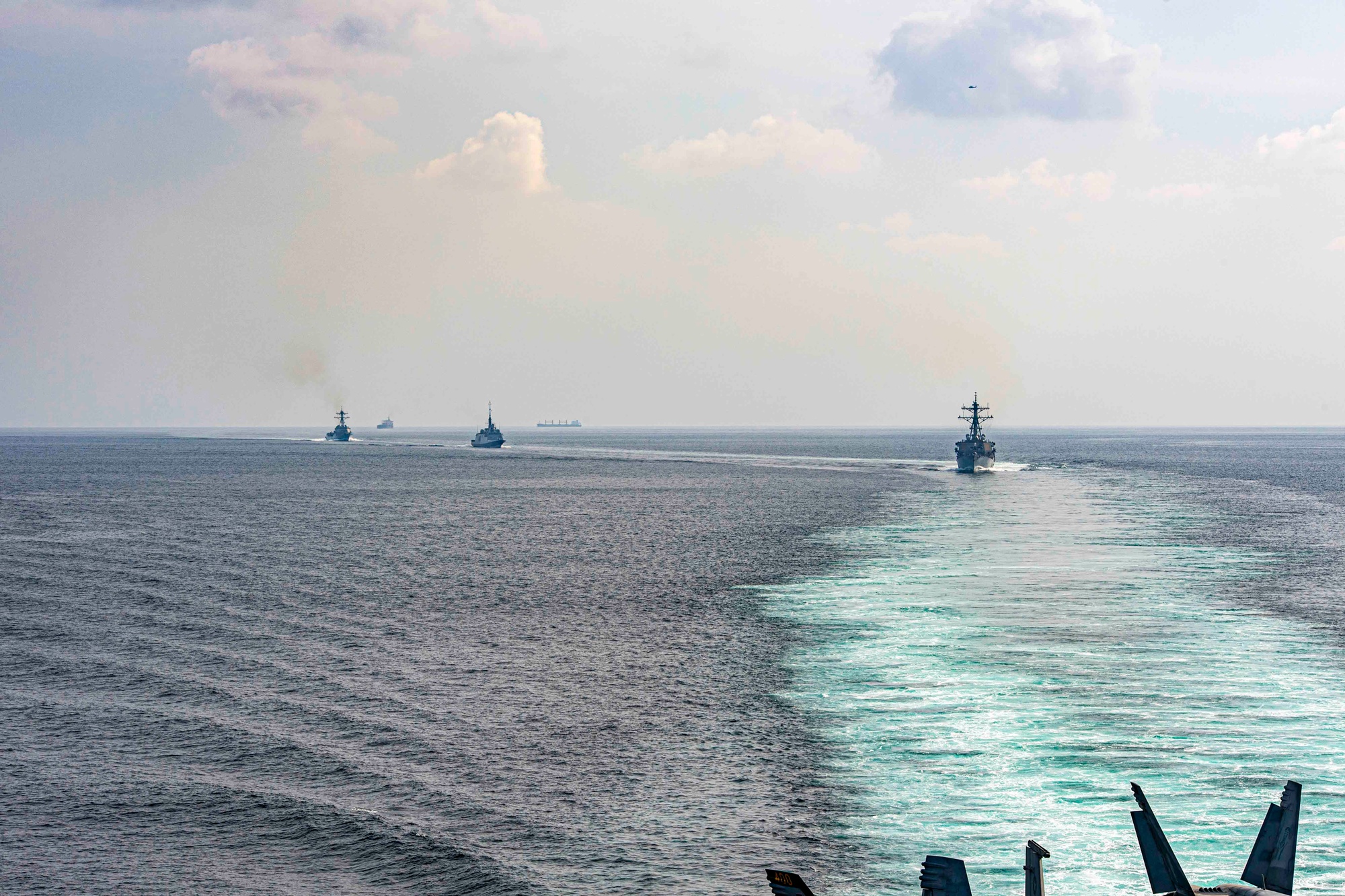 USS Stethem, French frigate FS Languedoc, and USS Gravely transit the Strait of Hormuz alongside the Eisenhower Carrier Strike Group