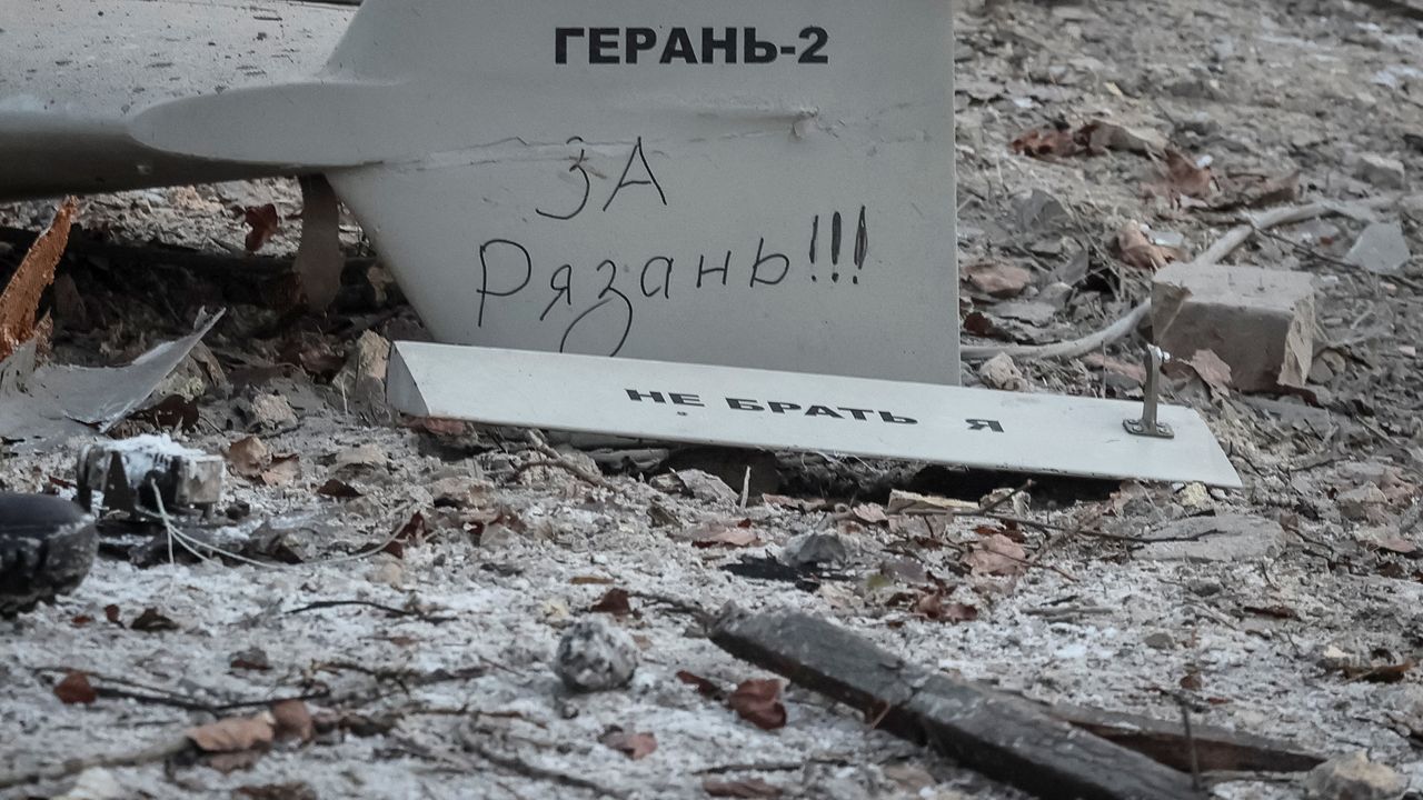 Wreckage of a downed Geran-2 attack drone lying on pavement in Kyiv