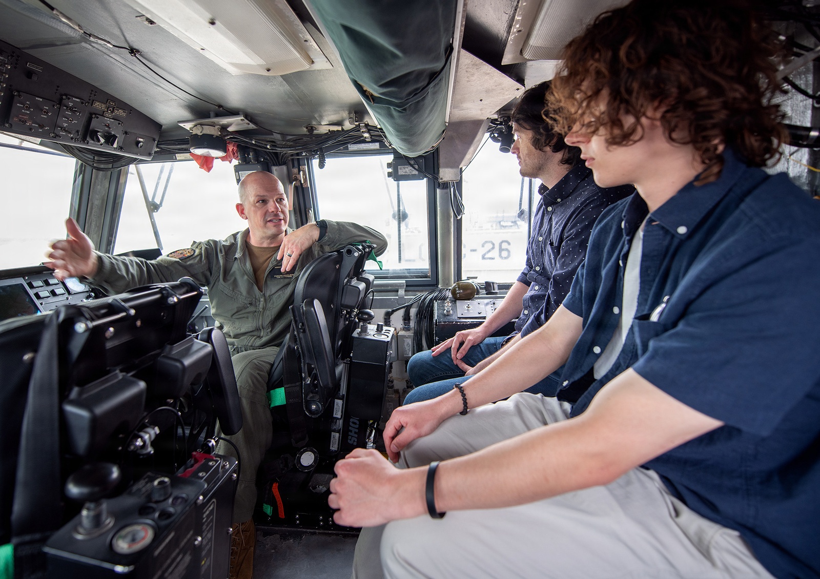 NAVSUP Business Systems Center personnel inspect an LCAC landing craft at Assault Craft Unit Four