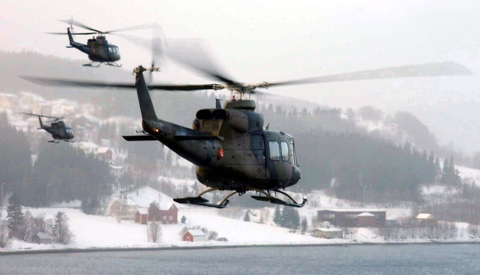Norwegian military Bell 412SP helicopters on the ground during a NATO exercise