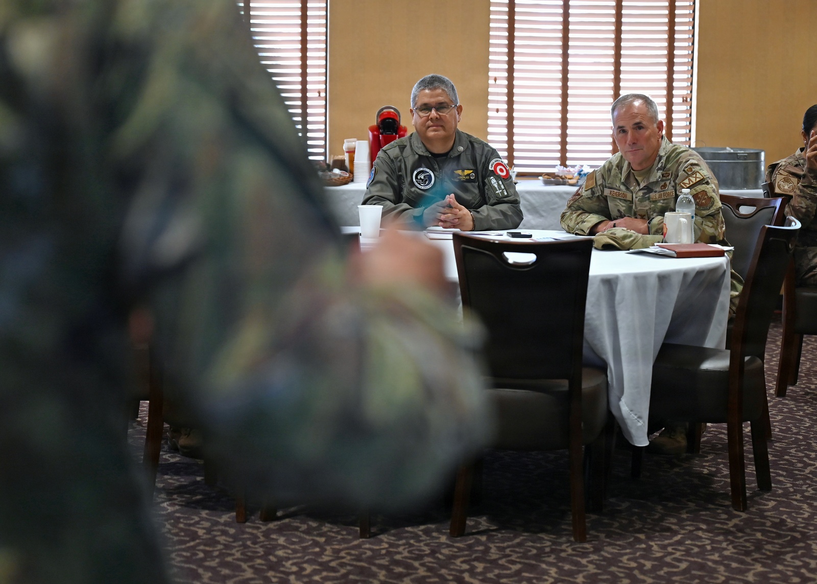 Peruvian Air Force Maj. Gen. Martin Asenjo Gallo is briefed on F-16 maintenance support at Davis-Monthan Air Force Base