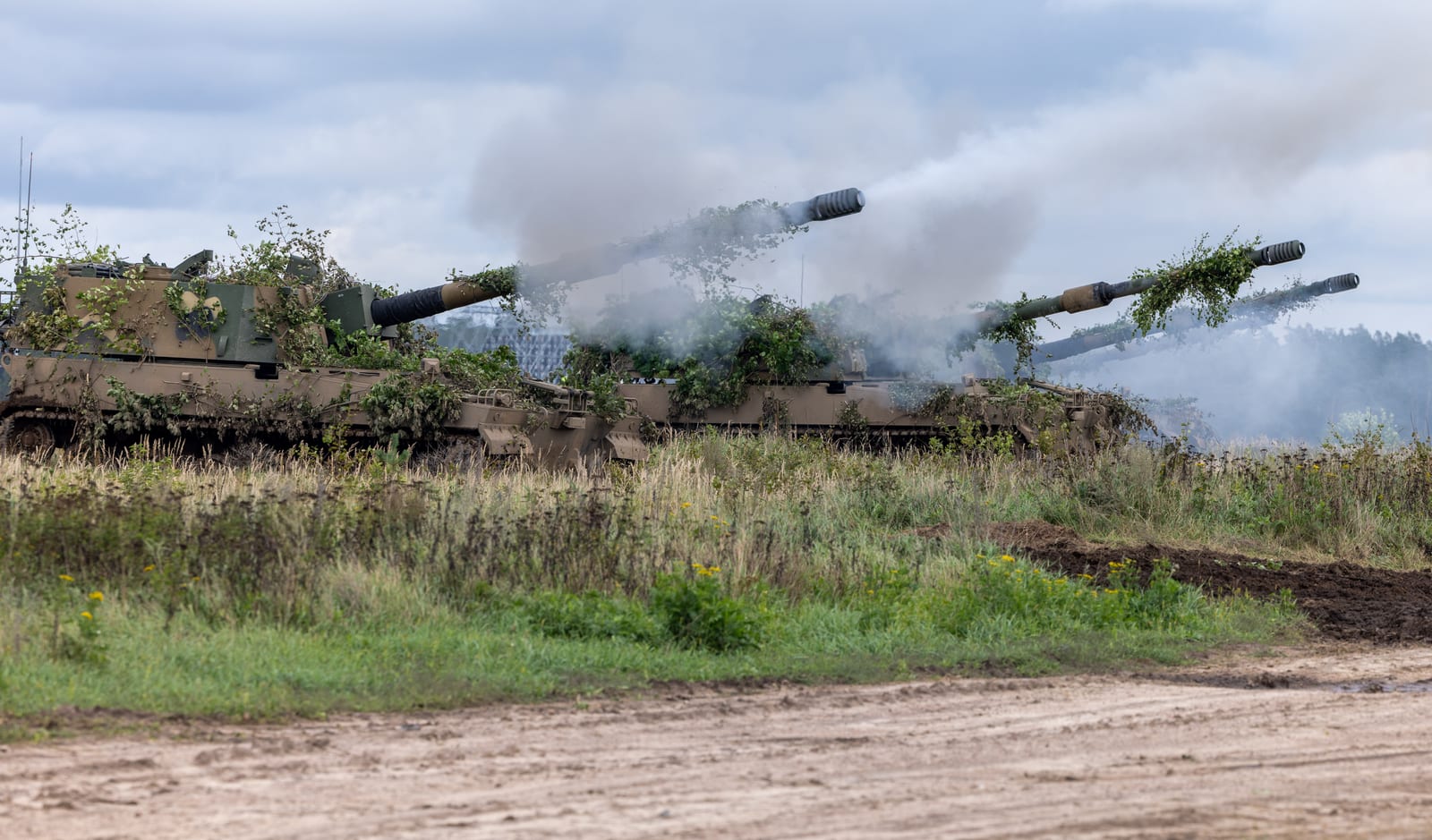 Polish Land Forces AHS Krab self-propelled howitzers firing during exercise Iron Defender