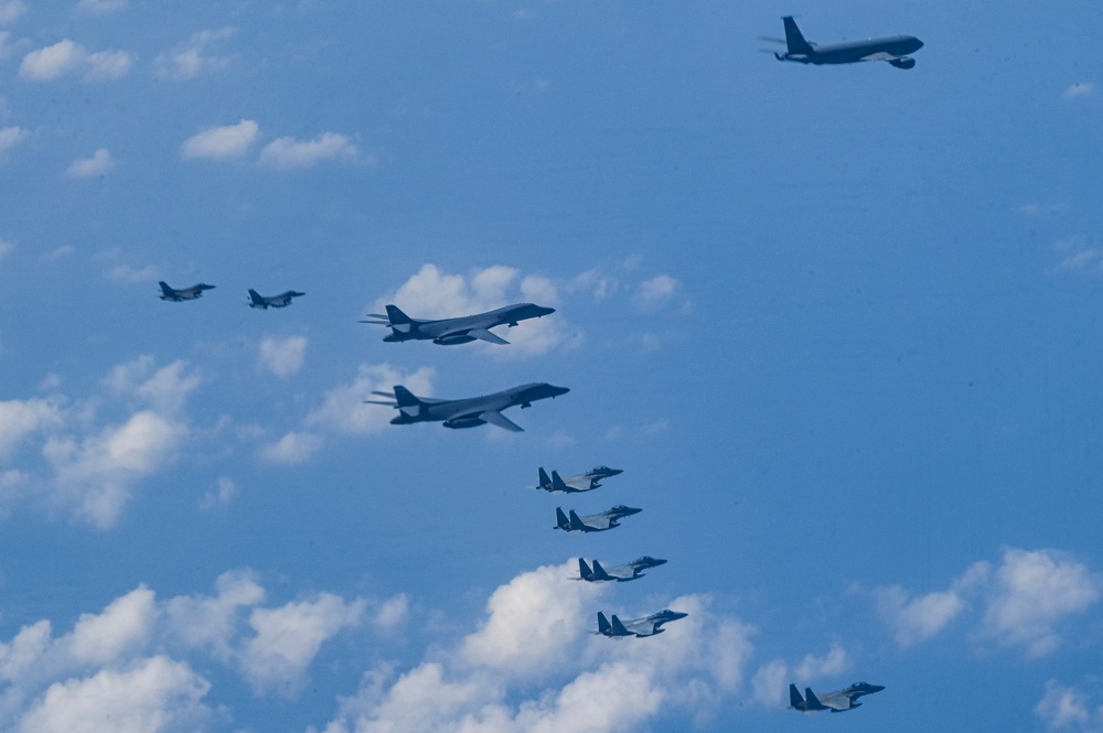 Royal Saudi Air Force F-15 fighter jets flying in formation with U.S. Air Force B-1 Lancer bombers and F-16 Fighting Falcons over the Red Sea