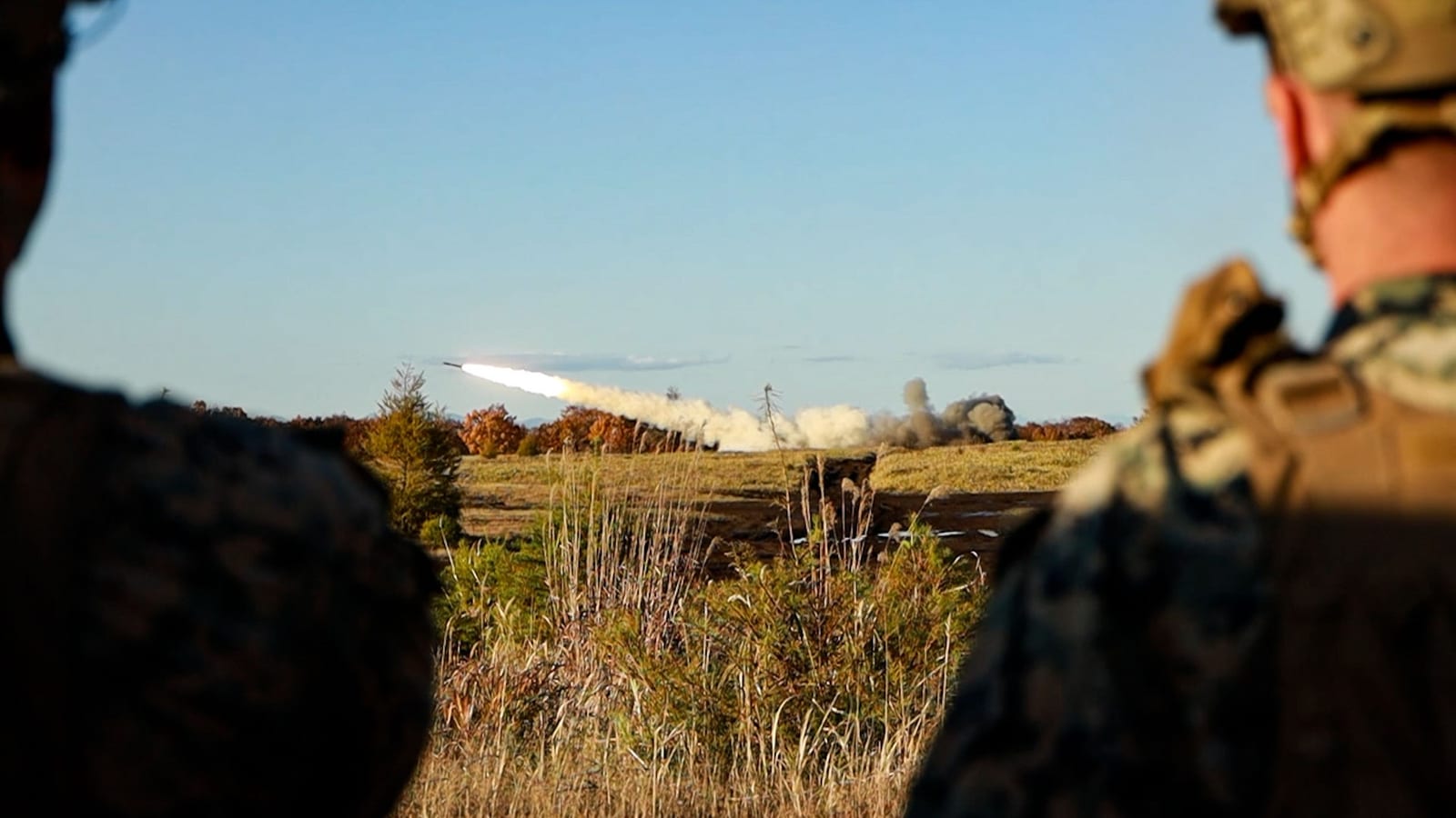 M142 HIMARS and M270 MLRS launchers conducting a bilateral live-fire exercise