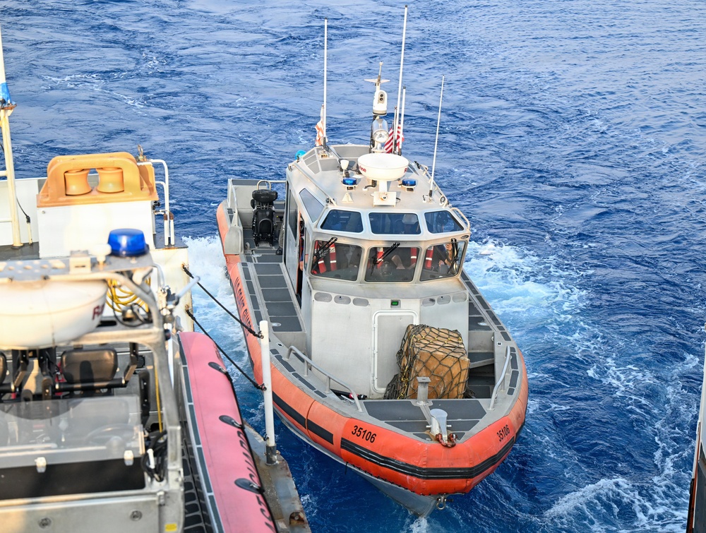 A US Coast Guard interceptor boat departs USCGC Midgett carrying Philippine Navy personnel during a maritime exercise