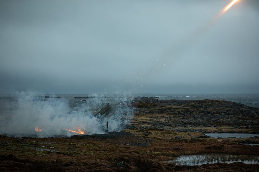A Norwegian Army NASAMS launcher fires a medium-range air defense missile during a live exercise