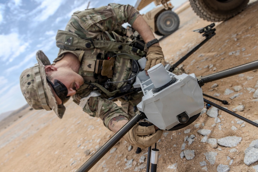 U.S. Army Sgt. Jonathan Simmons assembles a PDW C-100 drone during Project Convergence Capstone 6