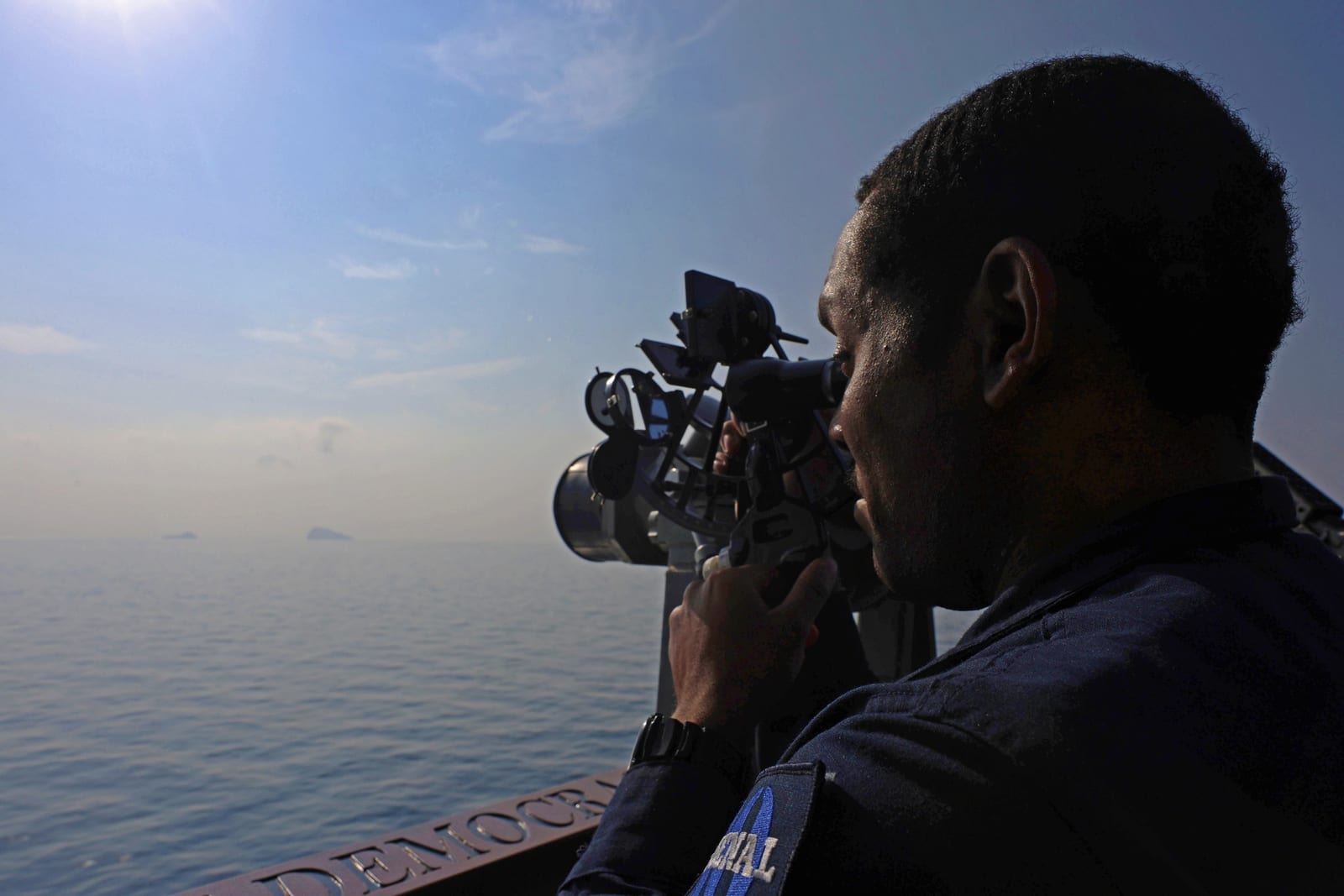 A U.S. Navy guided-missile destroyer transiting the Strait of Hormuz
